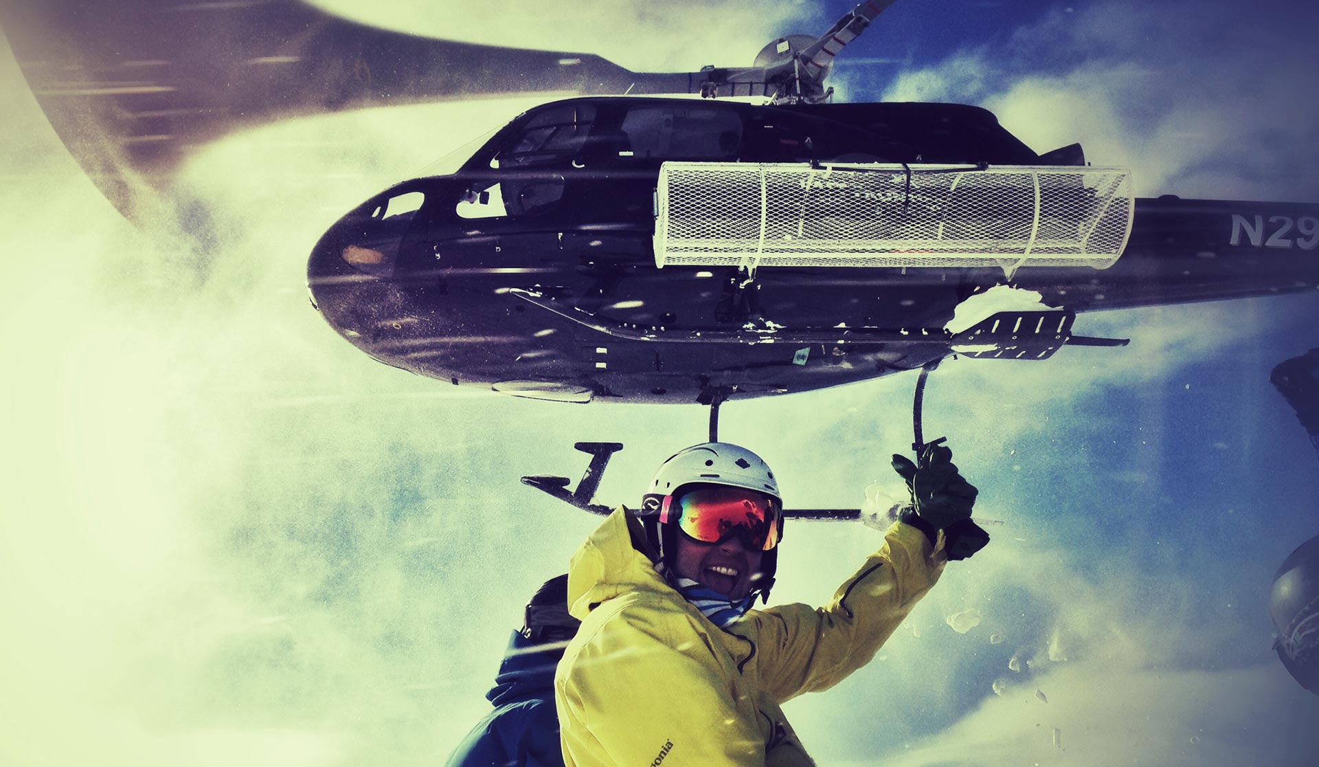 skier pointing at helicopter